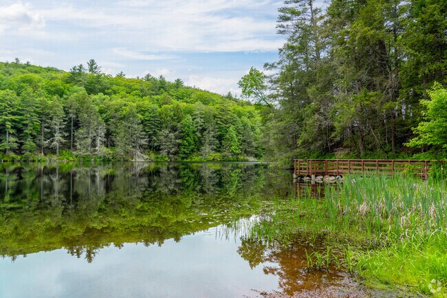 A wooden dock at Bigelow Pond in Union invites visitors to relax, fish or take in the peaceful water views.