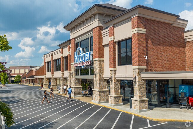 A bustling shopping plaza like Howell Mill Shopping Center provides residents with access to restaurants, grocery stores, and other essentials.