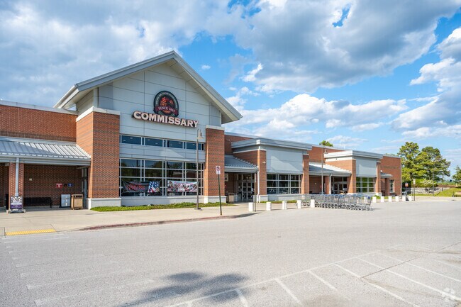 If you are in the Navy you can shop at the Commissary in Pendennis Mount.