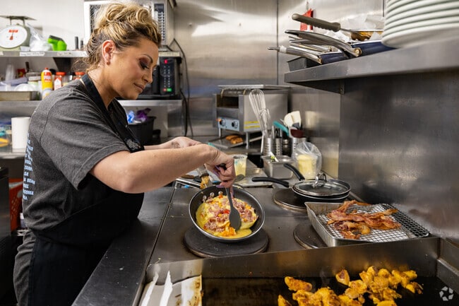 Staff prepares a hot breakfast at The Betsy Shoppes & Bistro in Boston.