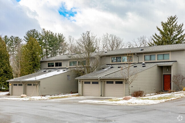 A wide drive runs through Geddes Lake giving townhomes plenty of space for parking.