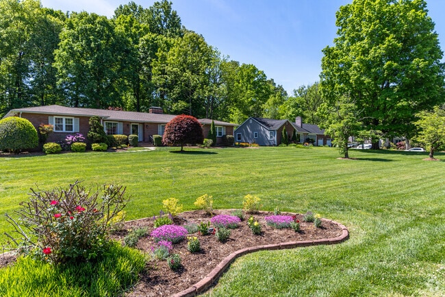 Chilhowee Hills homes along the Dogwood Trail showcase lush landscaping.