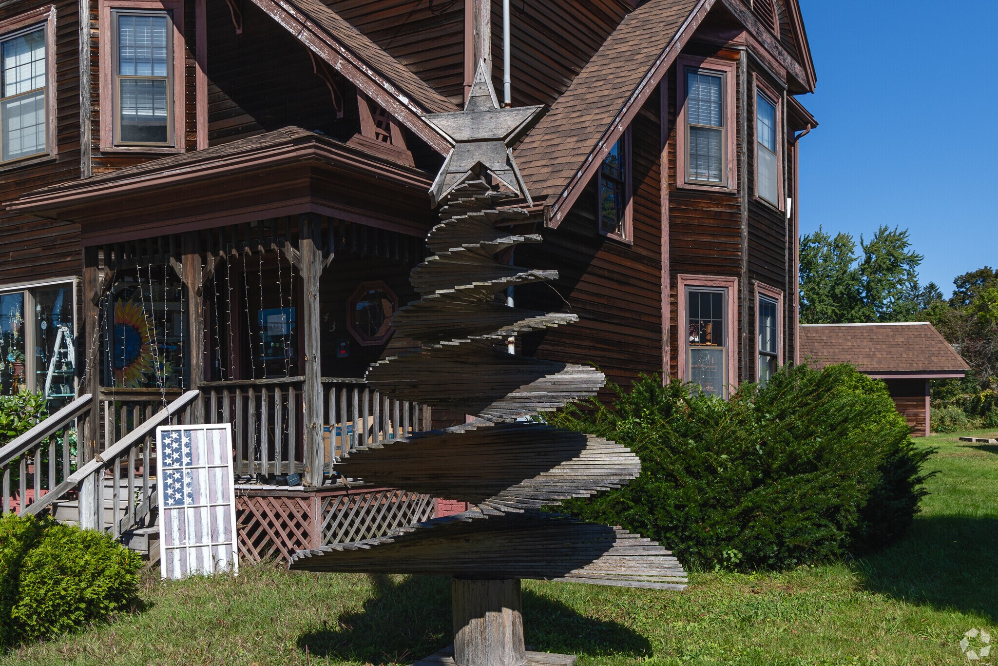 Uniquely crafted, wooded sculptures reside in the front yards in Walnut Square.
