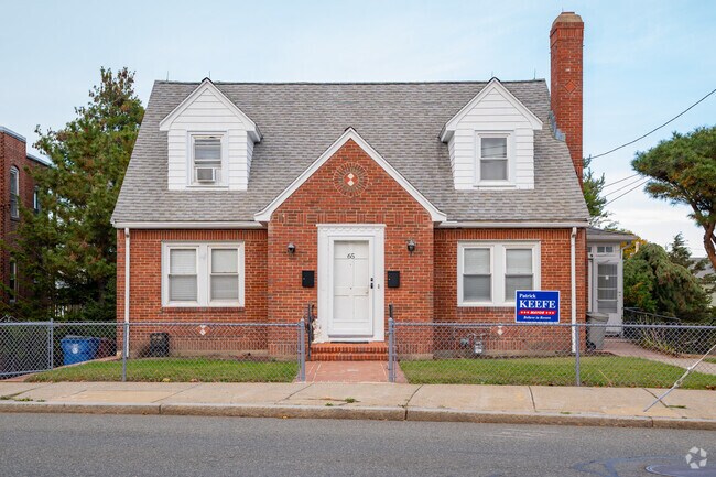 This brick Cape Cod-style home looks cozy for a single-family in West Revere.