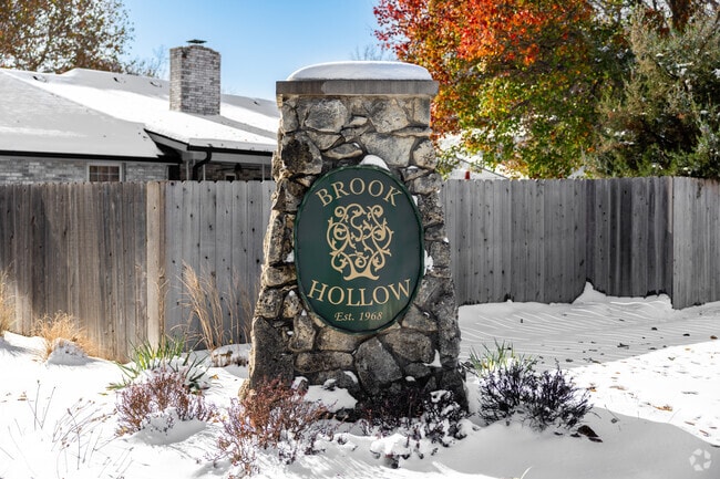 The entry for Brookhollow greets locals with a large stone sign.
