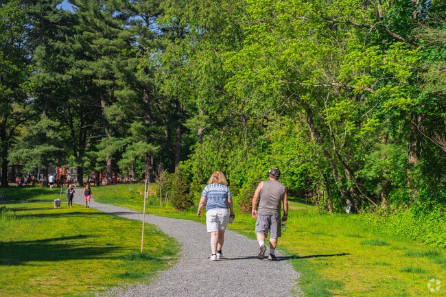 On beautiful days, locals of Walpole walk around the large outdoor field at Bird Park.
