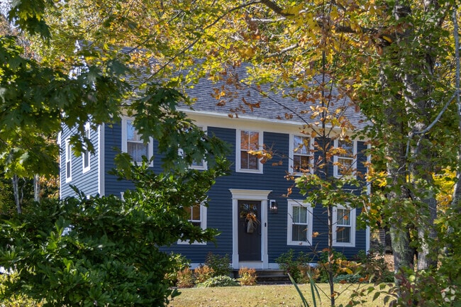 Durham, ME, features homes tucked within dense pine forests, offering privacy and a true connection to nature.