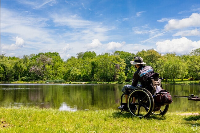 A man casting out at the pond in Bellevue State Park, just a short drive from Village at Fox Point.