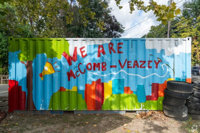 A mural outside The Community House, a gathering place for the community of Heymann Park.