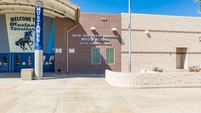 Tighter shot of the school name on the building.