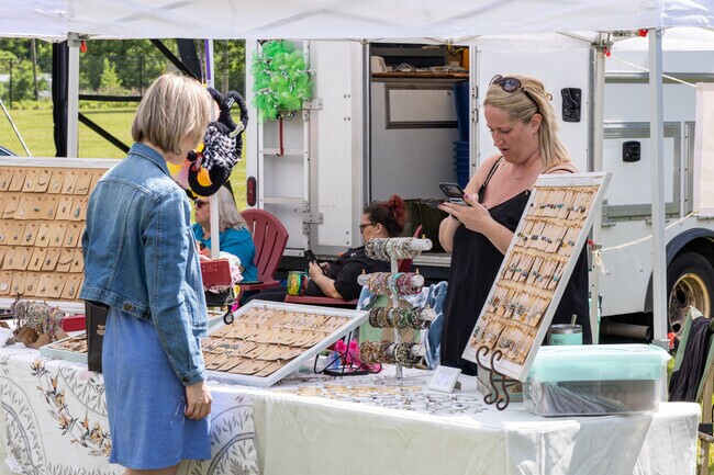 Buying a finely crafted piece of jewelry at the Steel Mill Street Fair in Florence, NJ.