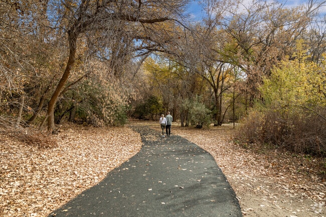 This couple enjoys a walk at Beus Trailhead in Southeast Ogden on a fall day.
