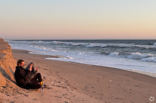 In Malibu, experiencing a sunset at Zuma Beach is a magical and serene experience.