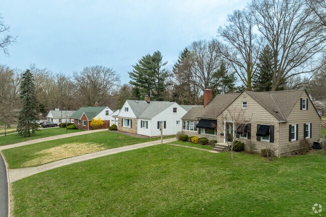 In the Cuyahoga View neighborhood, you can find Cape Cod-style homes nestled within spacious yards, offering a charming blend of style and outdoor space.