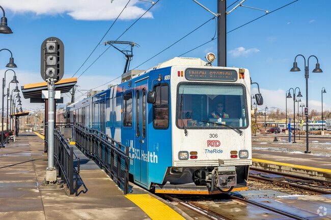 Catch the RTD light rail train at Oak Station in the Daniels neighborhood.