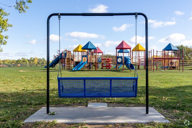 Have a seat and swing while the kids play at Oak Grove's Camden Park Swing