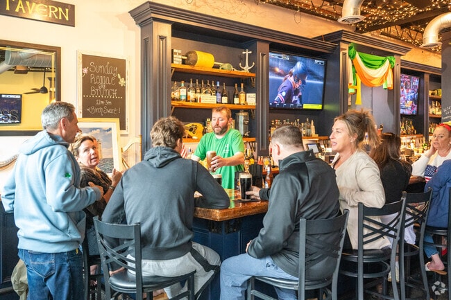 Scituate residents embrace the lively atmosphere and music at Hibernian Tavern.