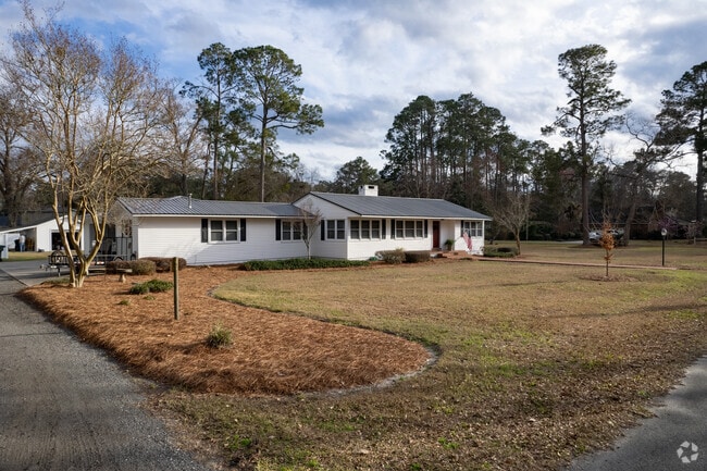 Houses in Jesup sit on manicured lawns.