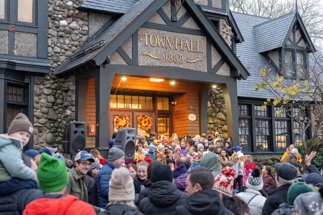 The steps of town hall are a stage for school choruses at the Barrington Tree Lighting.