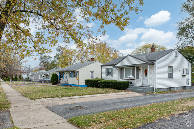 Homes in Norshore Park sit neatly beneath mature trees on sidewalk lined streets.