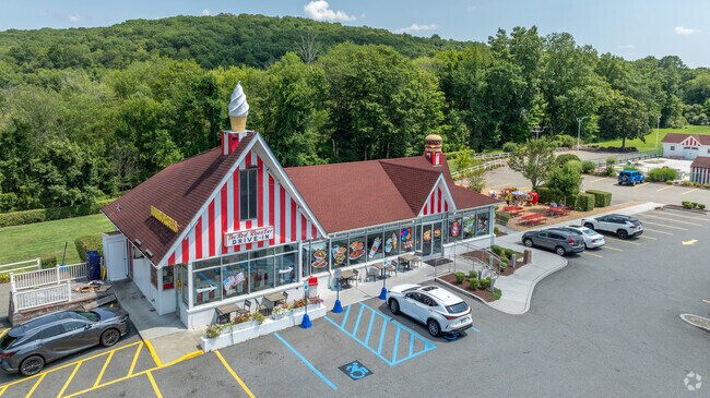 Red Rooster Drive-In in Brewster has a retro exterior with rooftop décor.
