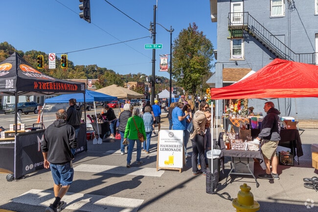 Families enjoy food and seasonal activities at the New Brighton Fall Festival.