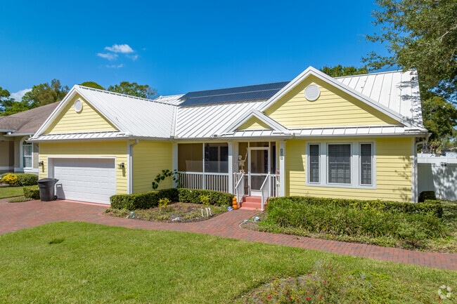 Colorful exteriors and green lawns add Florida charm to Harcourt homes.