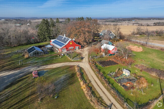 Farm near Oronoco features solar panels and sustainable agricultural practices.