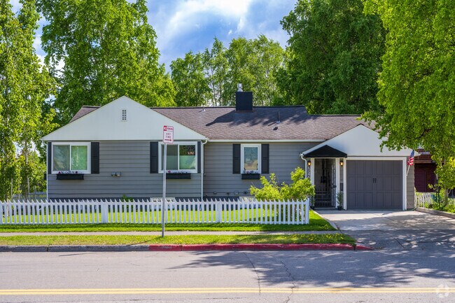 A white picket fence adorns the yard of this ranch style home located in South Addition.