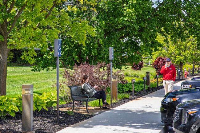 Thurston residents visit Domino's Farms business park to walk and soak in the sun.