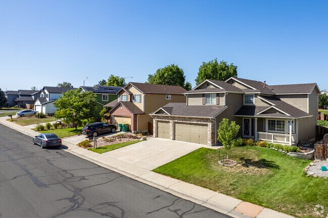 A row of contemporary craftsman homes with three car garages in Lexington Estates.