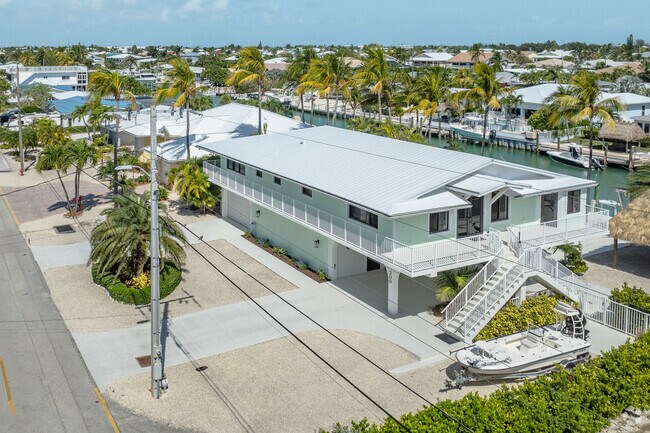 Raised homes in Marathon, FL are built alongside beautiful waterfront views.