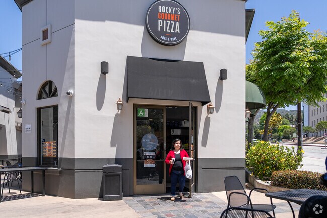 The menu at Rocky's in Greenbriar features a diverse selection of pizzas, including unique offerings like the Rocky's Mix Makhloot Pizza, which combines pizza sauce, mozzarella cheese, mushrooms, hot dog, onions, and green peppers.