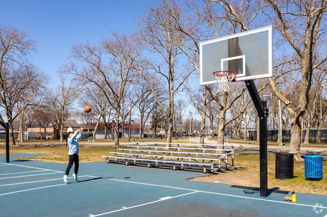 Playing basketball at one of the many courts in Lincoln Park in West Side Jersey, City, NJ.