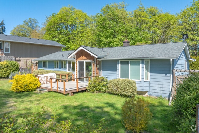 Live in a charming Rambler surrounded by greenery in Madrona Meadows.