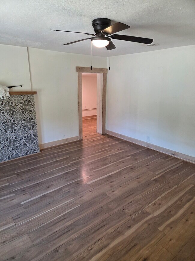 Living room leading to front door and mud-room