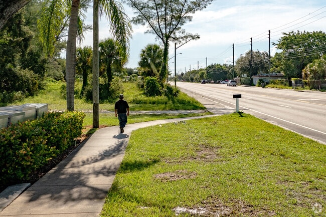 A man strolls down the sidewalk on Westgate Avenue in the West Gate Estates neighborhood.
