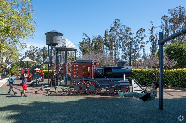 Kids having fun and playing at Alpine Park in Burlingame Gardens.