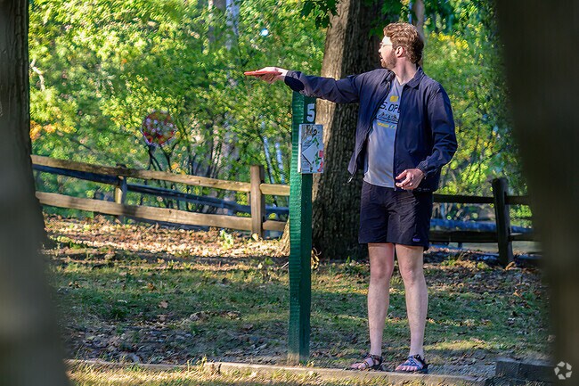 A golfer lines up his shot at the disc golf course at Murdock Park near Perrin.