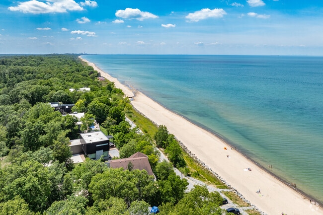 Indian Dunes National Lakeshore is heavily wooded with homes on the beach.