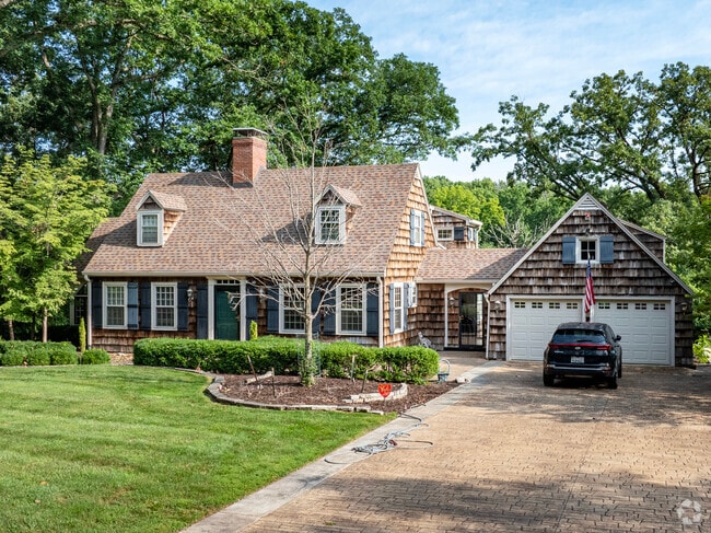 Cape Cod style cottages nestled in the woods of Springfield Lake Shore are popular for privacy.