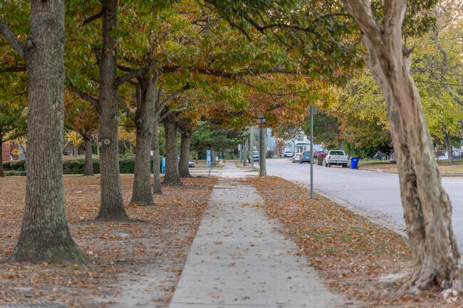 Locals stroll through the serene charm of Foxhall's tree-lined streets.