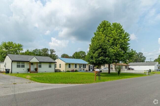 Homes in Dollartown sit on quiet roads with no sidewalks.