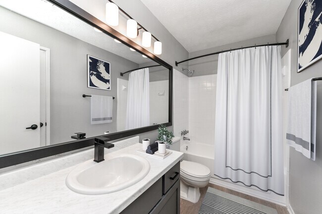 Bathroom with upgraded fixtures, lighting and hardware