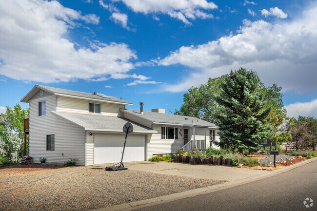 A split-level home displays the beauty of simple landscaping in Orchard Mesa.
