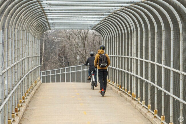 An overpass on 151 ties the Southwest Commuter Path into Orchard Ridge.
