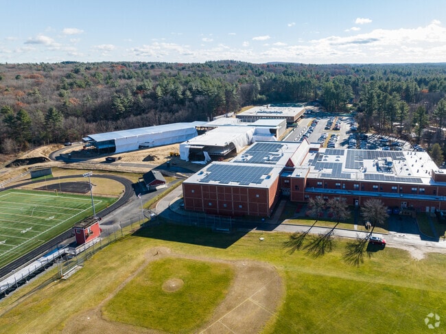 Aspiring baseball athletes practice on the baseball diamond behind the Tyngsborough High School.