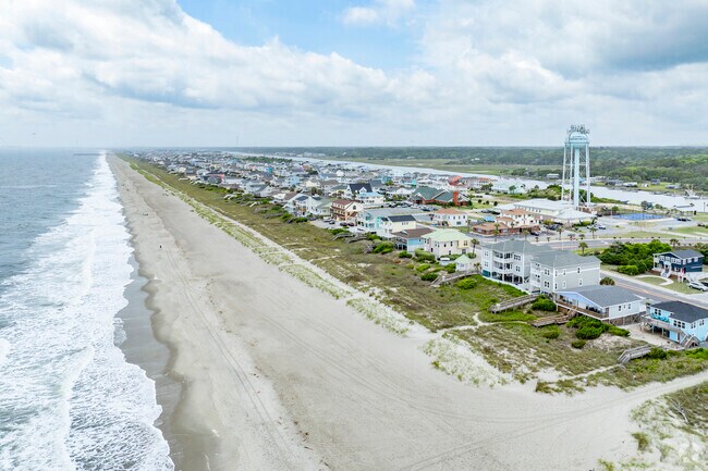 Holden Beach's commitment to preserving its natural beauty includes regulations limiting building heights and commercial development.
