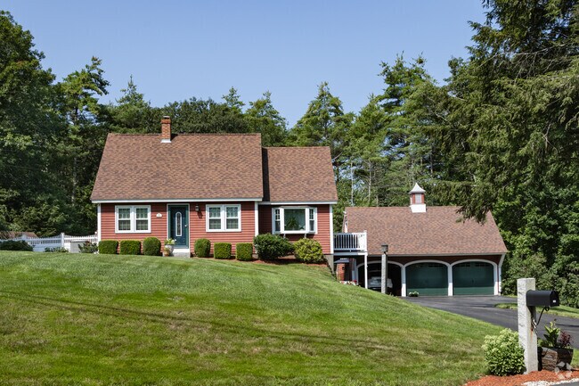 This quaint Cape Cod home is nestled in Lake Arrowhead.