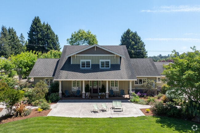 This Craftsman-style home in Corralitos features a full-width porch, dormer windows, and lush gardens.